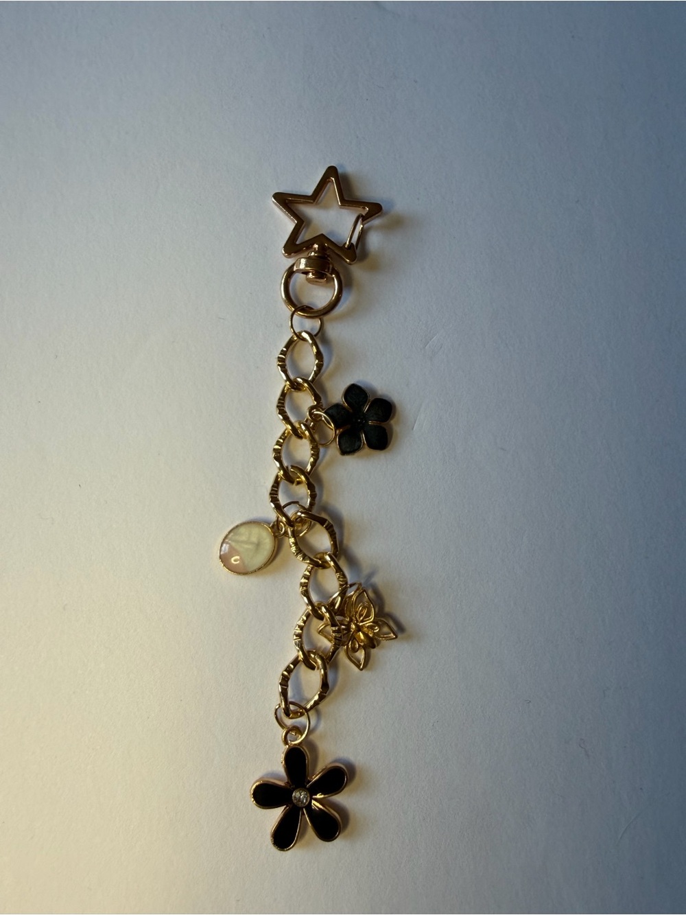 Gold-Tone Black Flower Charm Bag Charm
